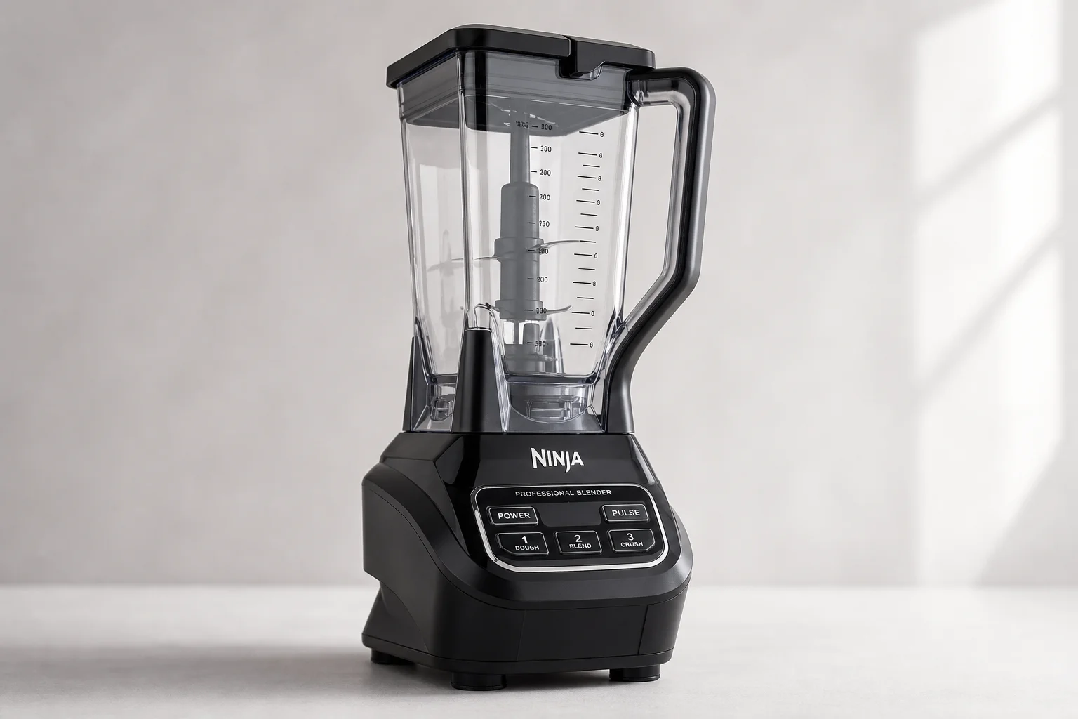 Vitamix Explorian E310, Ninja Professional Blender, and Beast Blender arranged on neutral backdrop