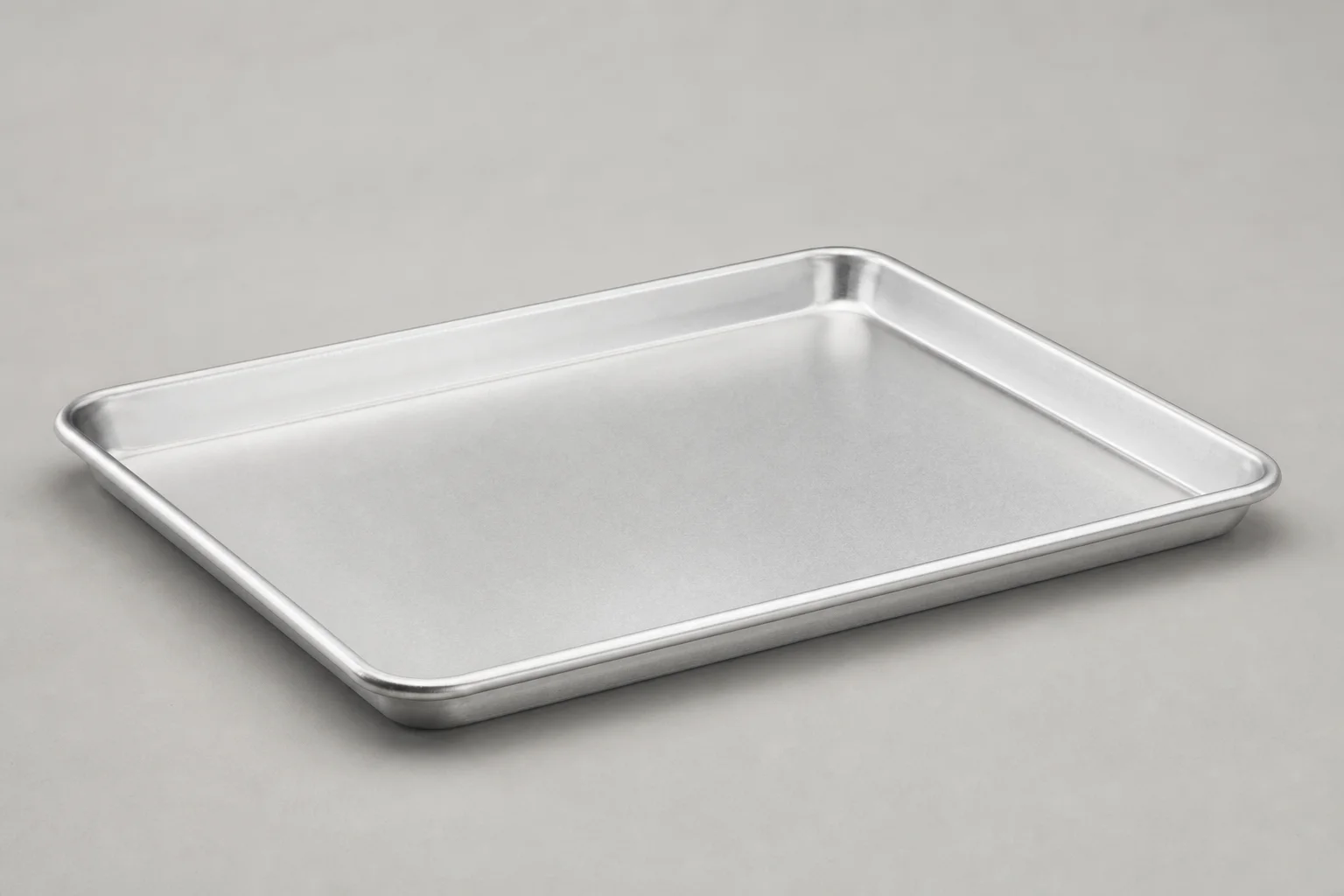 Six sheet pans arranged in a grid showing different styles and materials