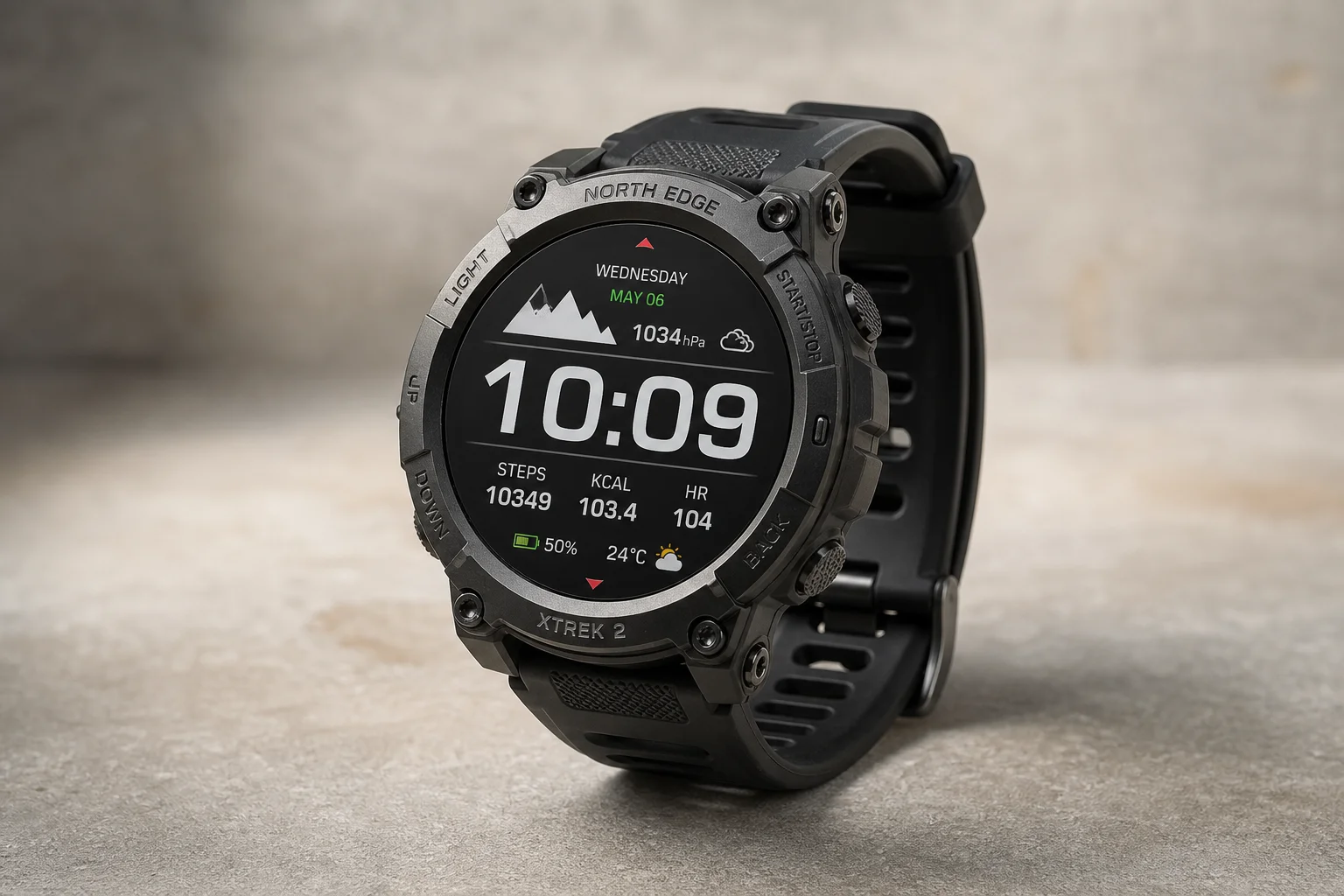 Five smartwatches displayed on concrete surface showing different designs and styles