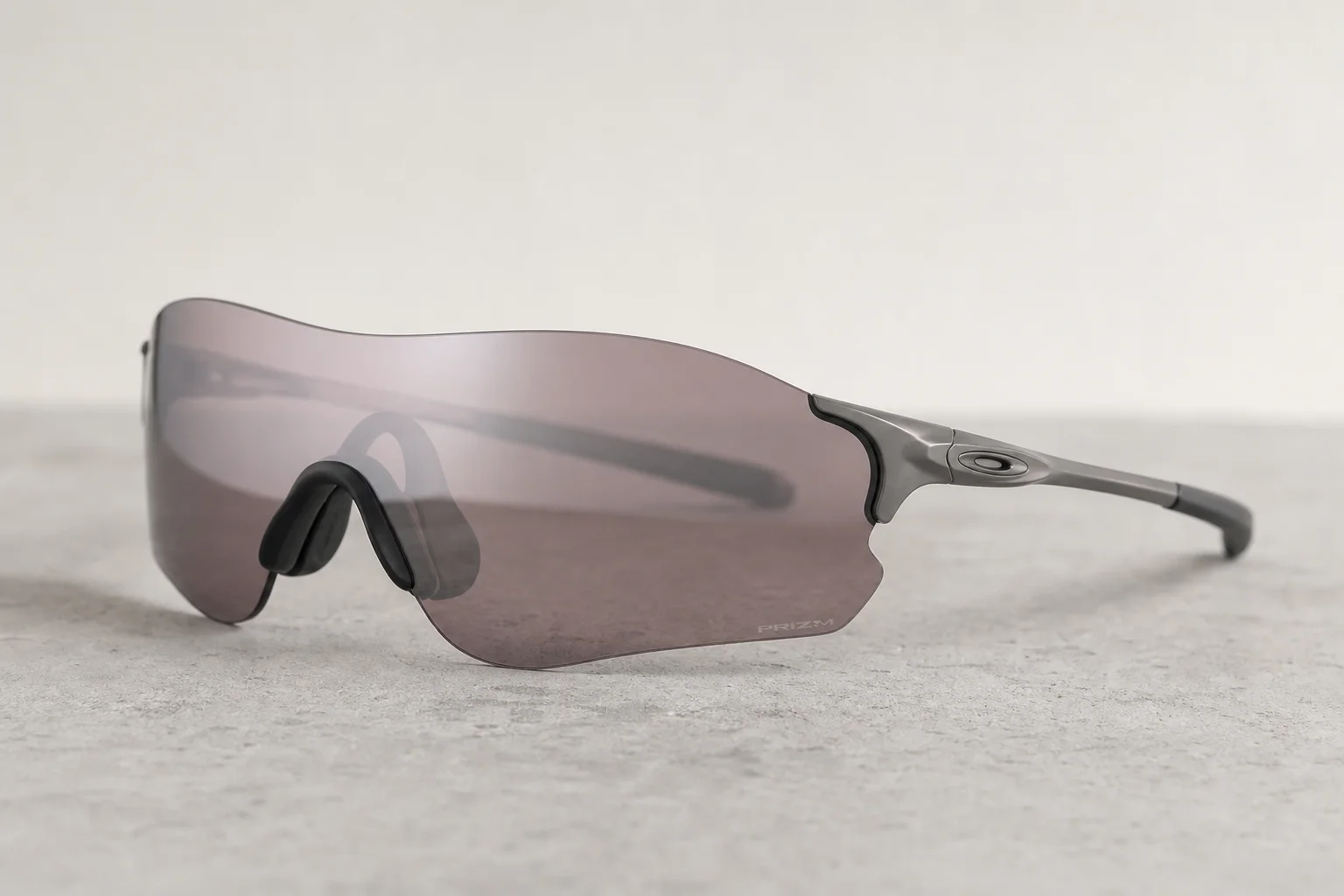 Seven Oakley shield sunglasses arranged on neutral backdrop showing different frame styles