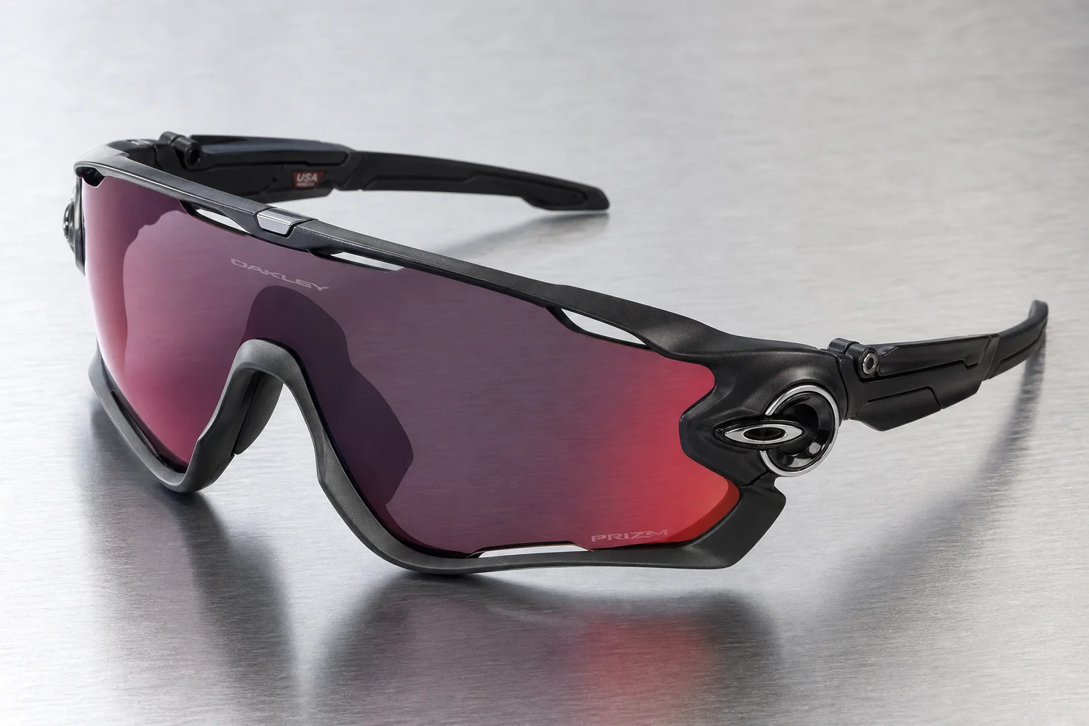Seven Oakley shield sunglasses arranged on neutral backdrop showing different frame styles