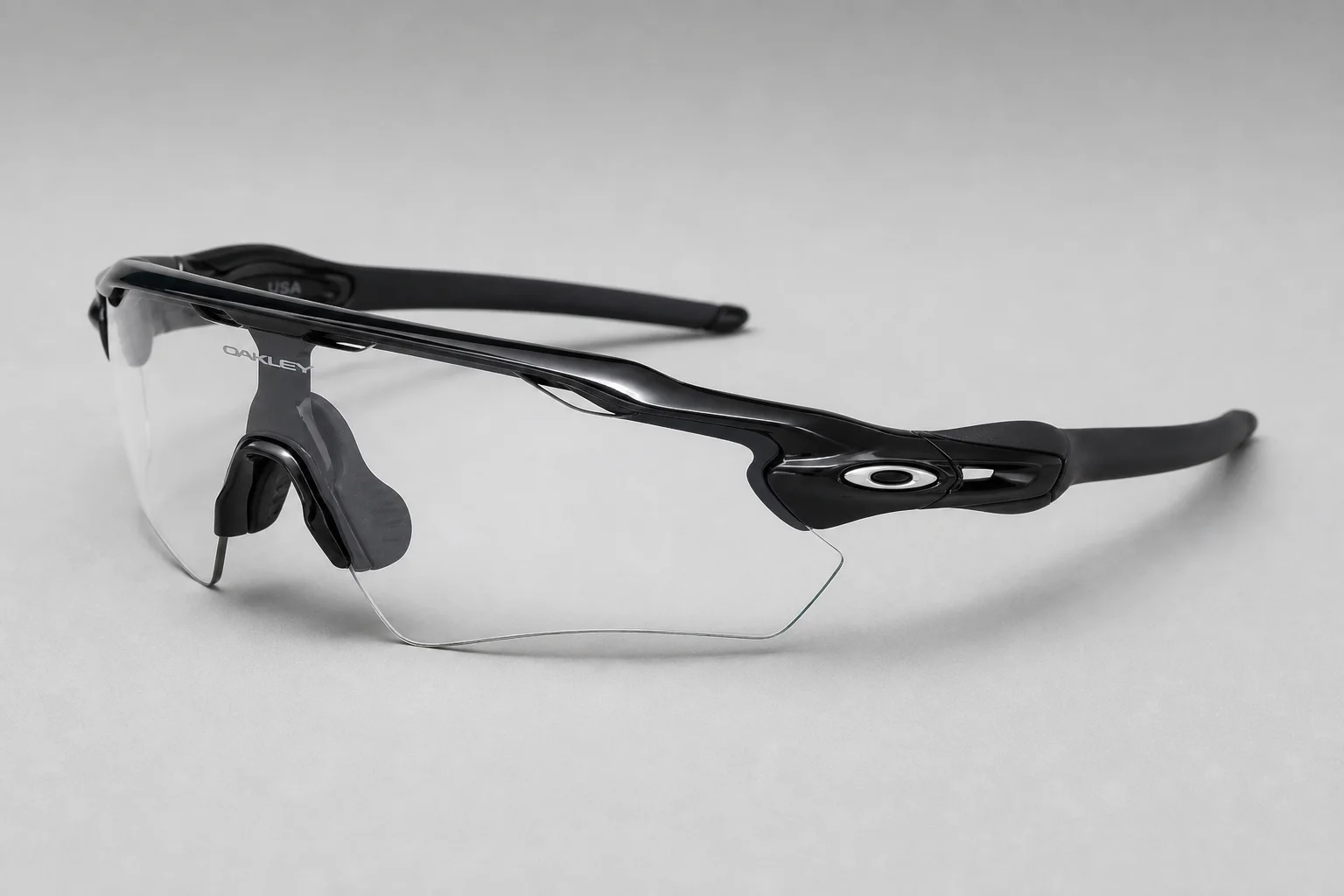 Oakley Sphaera and Radar EV Path sport sunglasses side by side on neutral backdrop