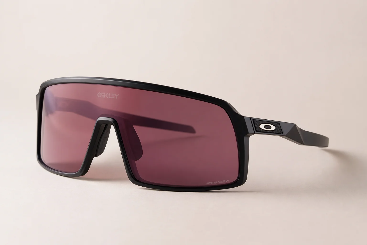 Seven Oakley shield sunglasses arranged on neutral backdrop showing different frame styles