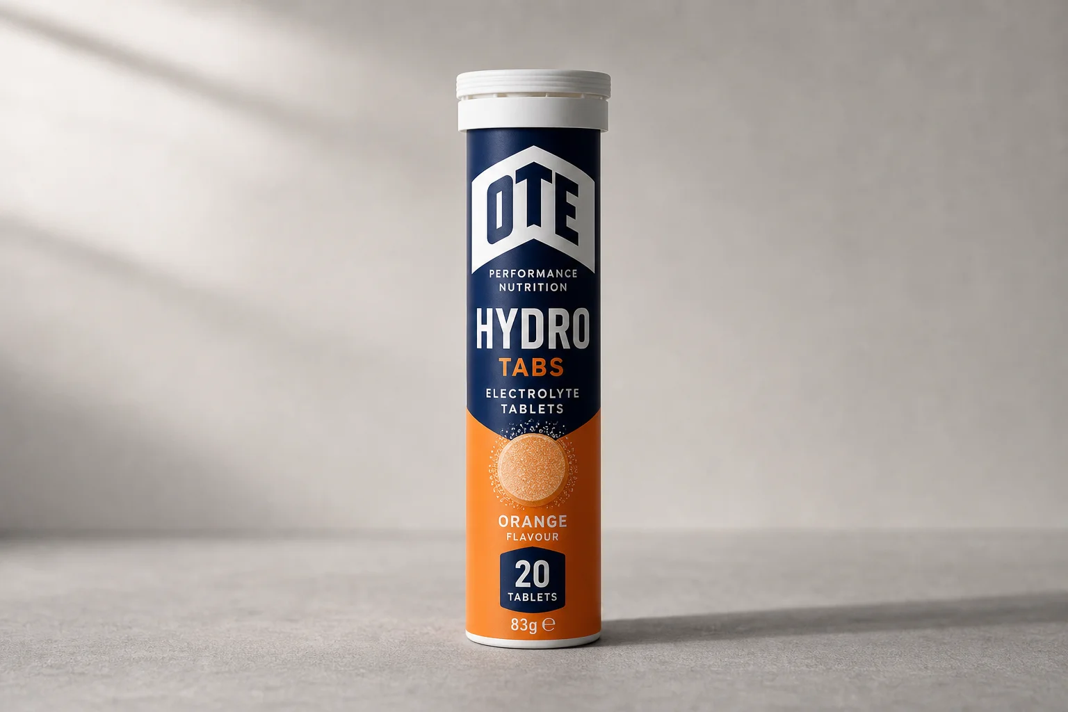 Collection of electrolyte products including powders, tablets, and sachets arranged on concrete