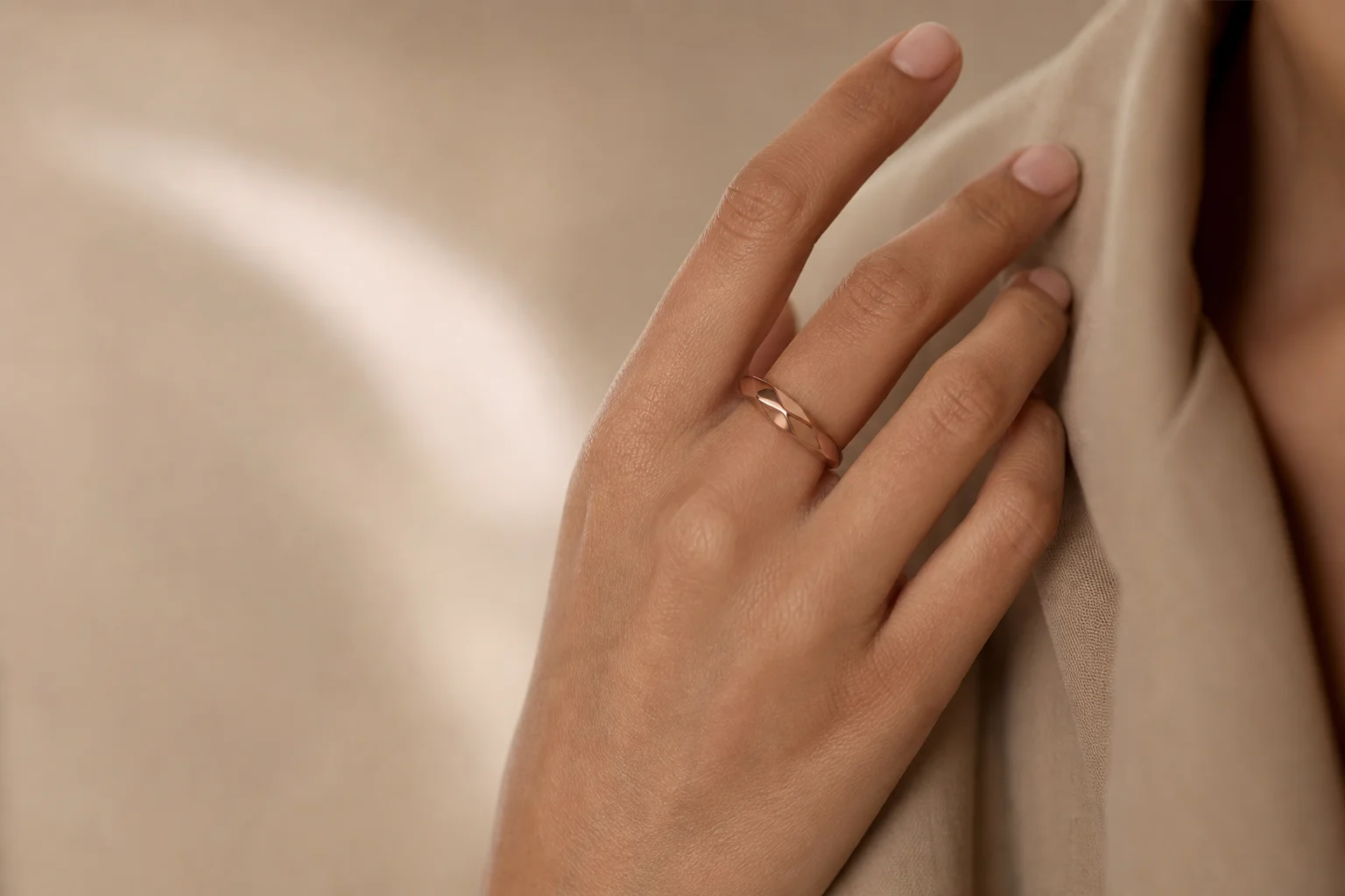 Deep rose Oura Ring 5 on a hand with olive skin tone