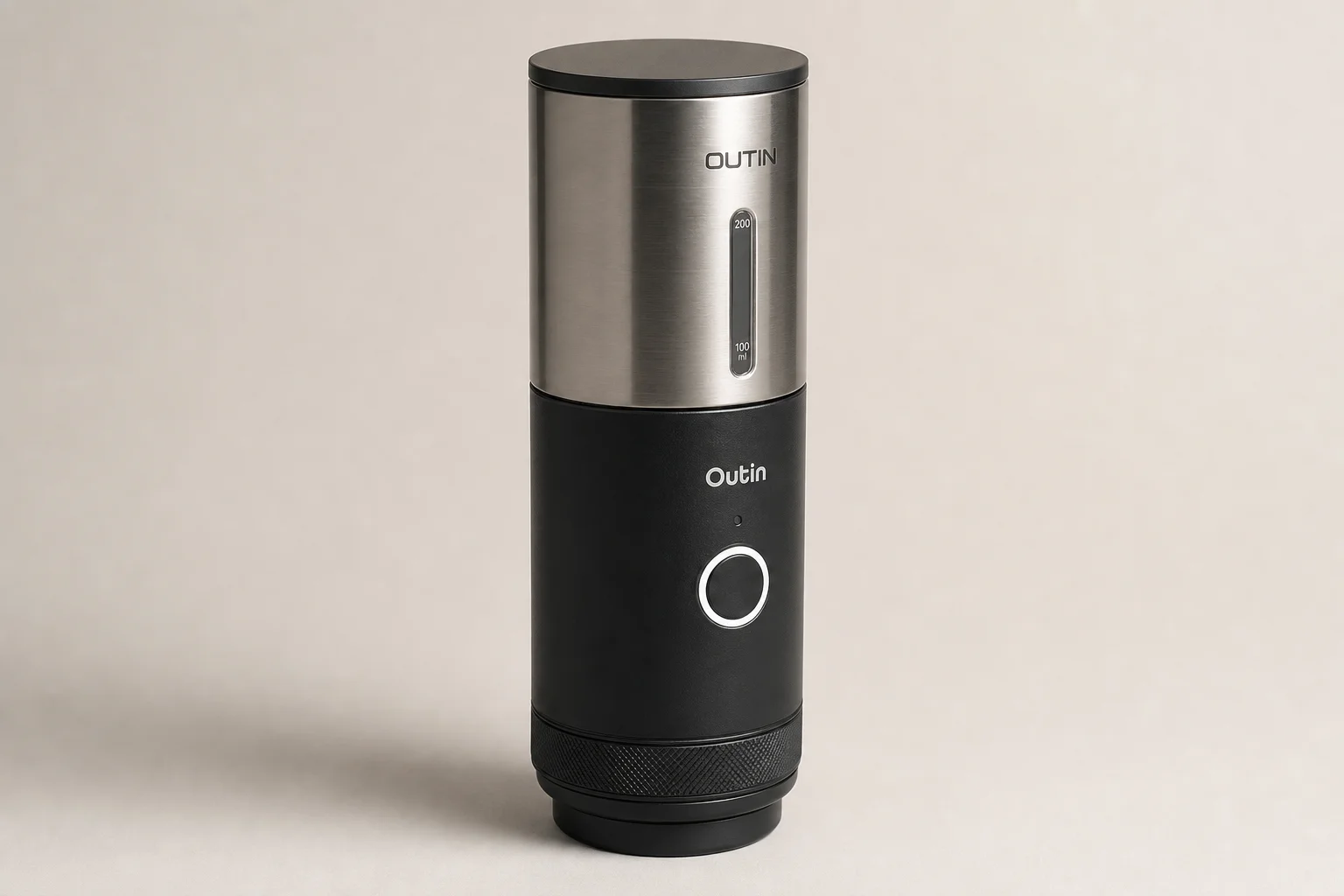 Outin Mino, Nano, and Fino portable espresso maker and grinder on concrete