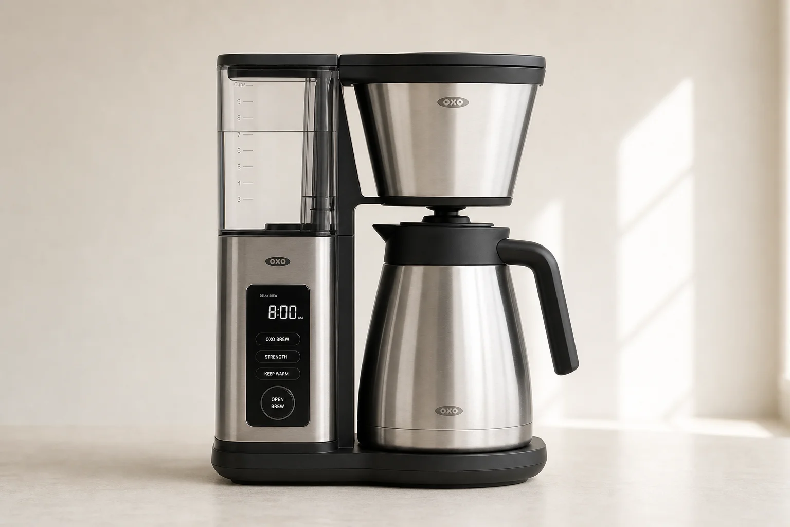Six automatic coffee makers arranged in a line on concrete surface