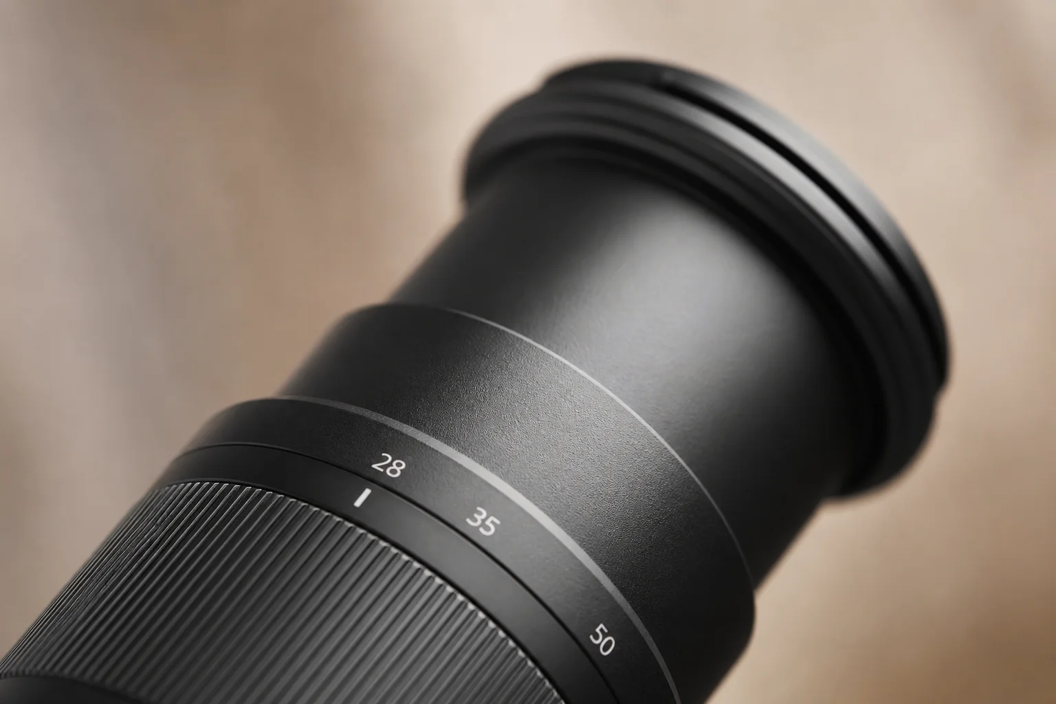 Close-up of camera lens barrel showing focal length markings and zoom mechanism