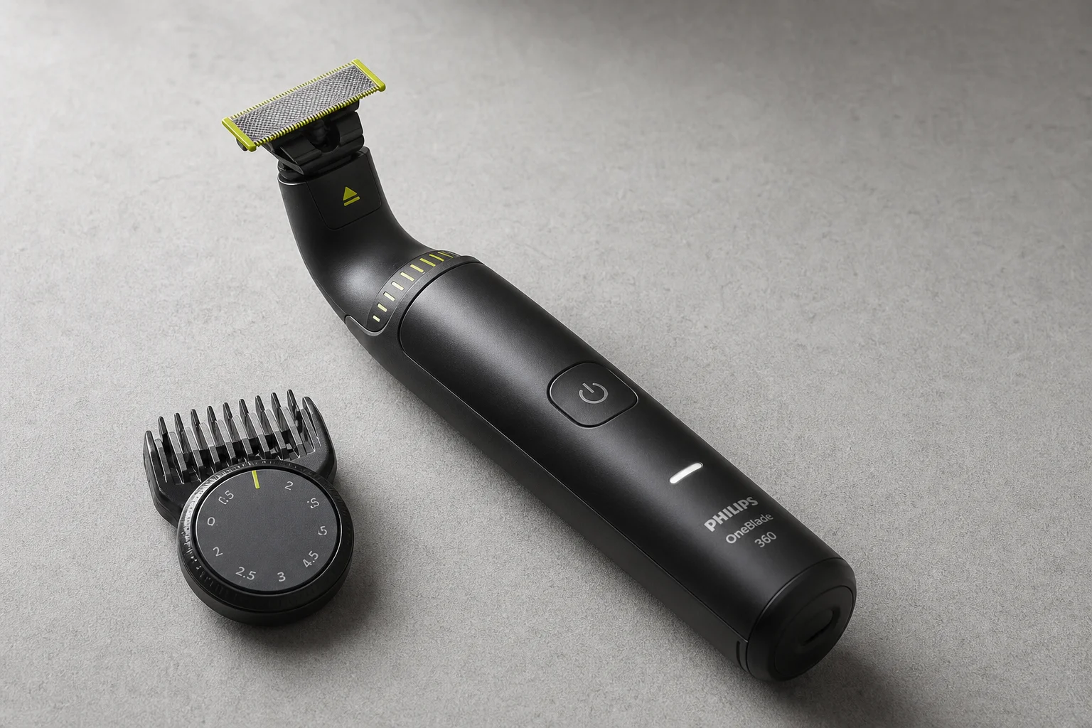 Five professional beard and hair trimmers arranged on concrete surface