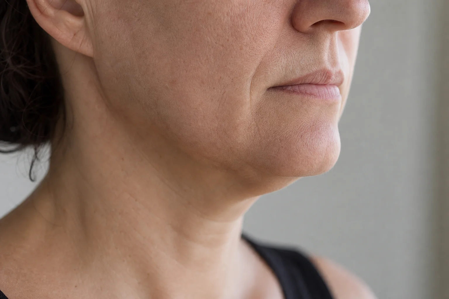 Close-up of lower face and jawline showing fine lines and skin texture