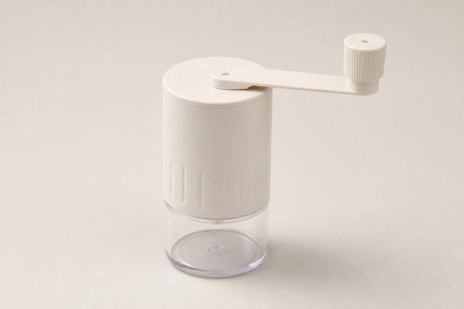 Seven premium hand coffee grinders arranged on concrete surface