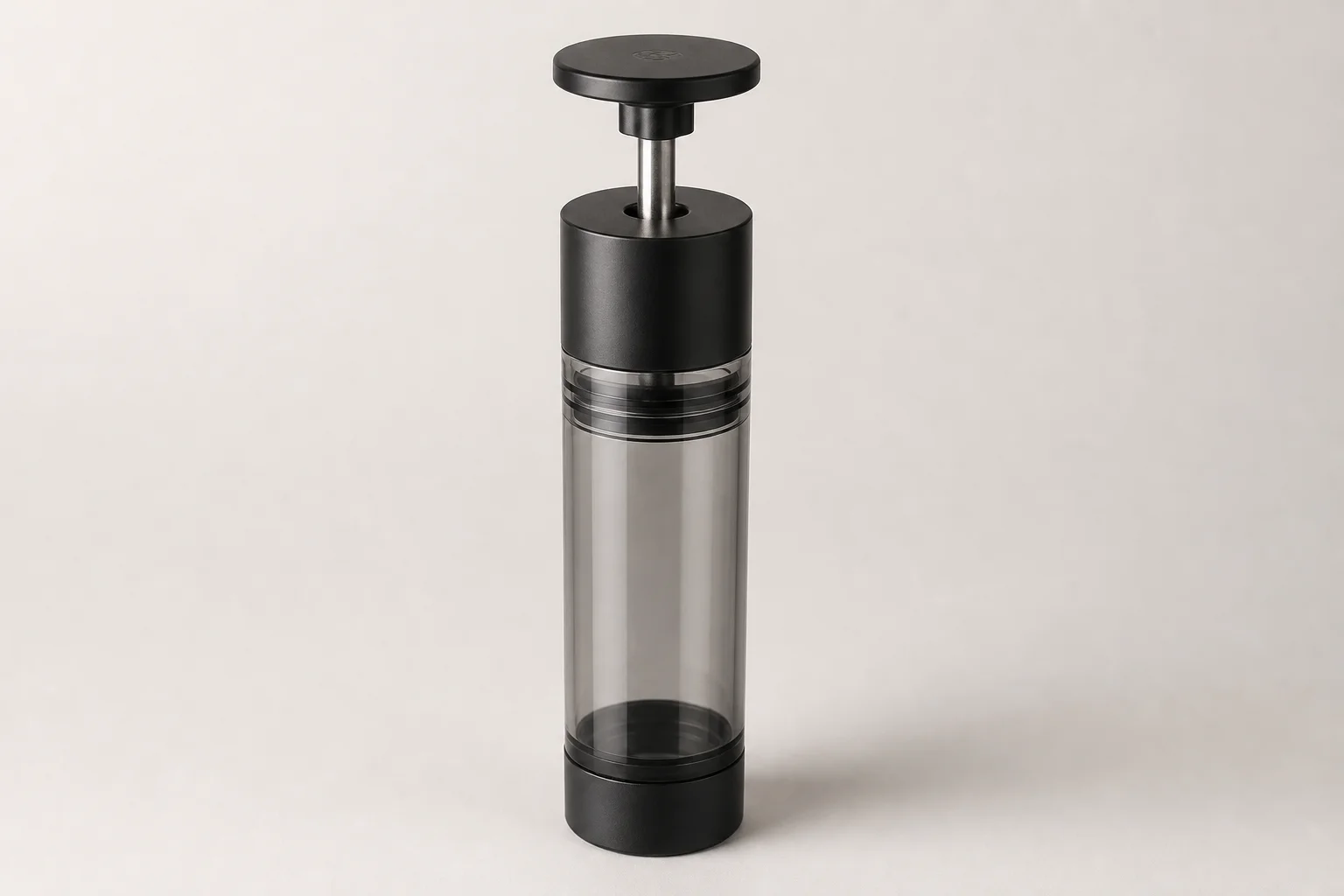 Eleven coffee storage containers arranged by category on concrete surface