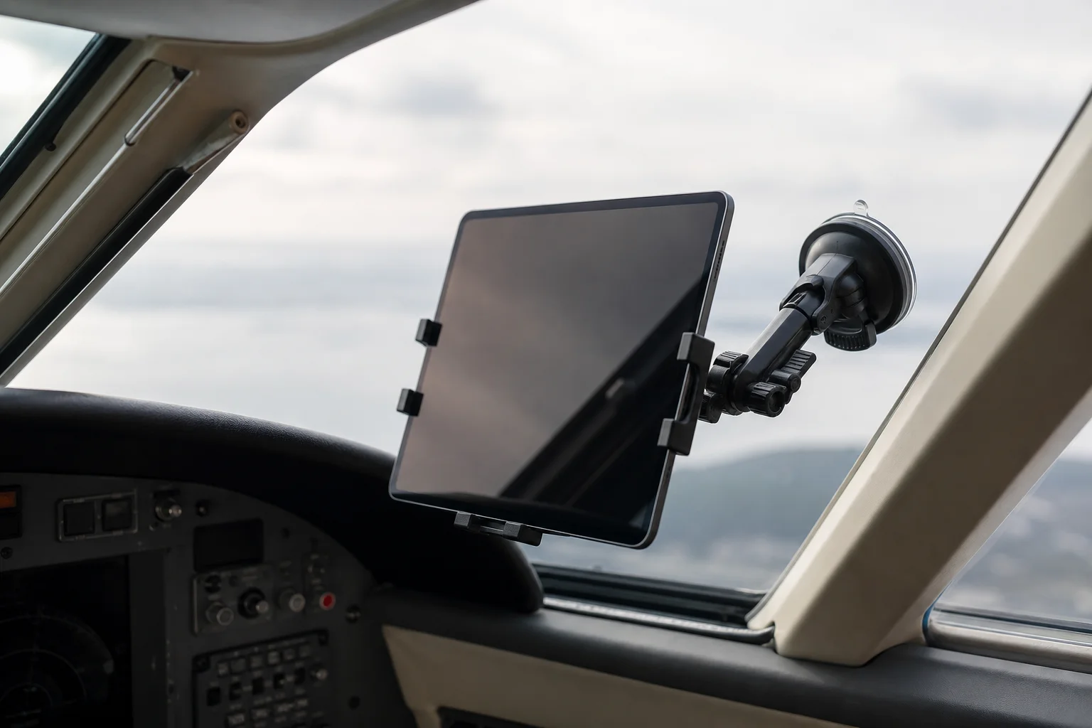 Tablet mounted securely on an aircraft windshield with suction cup mount
