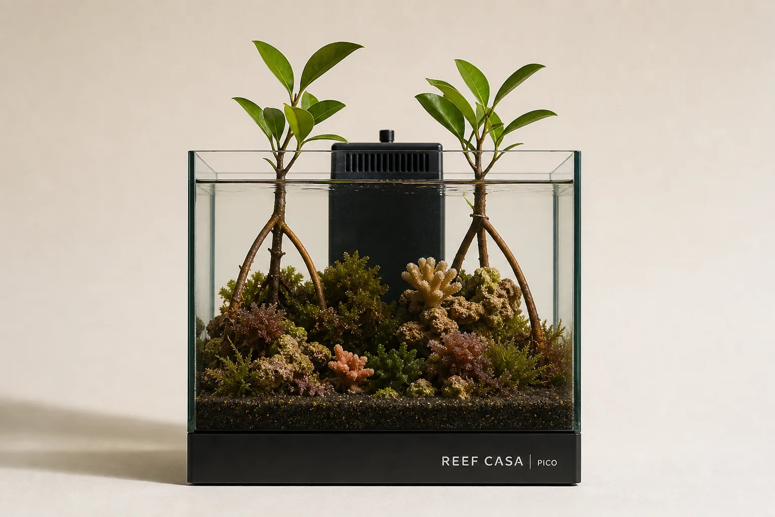 Three nano reef aquarium systems and automation equipment displayed together