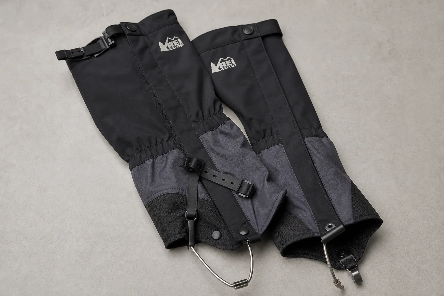 Winter hiking boot setup with pac boots, socks, gaiters, and booties on snow