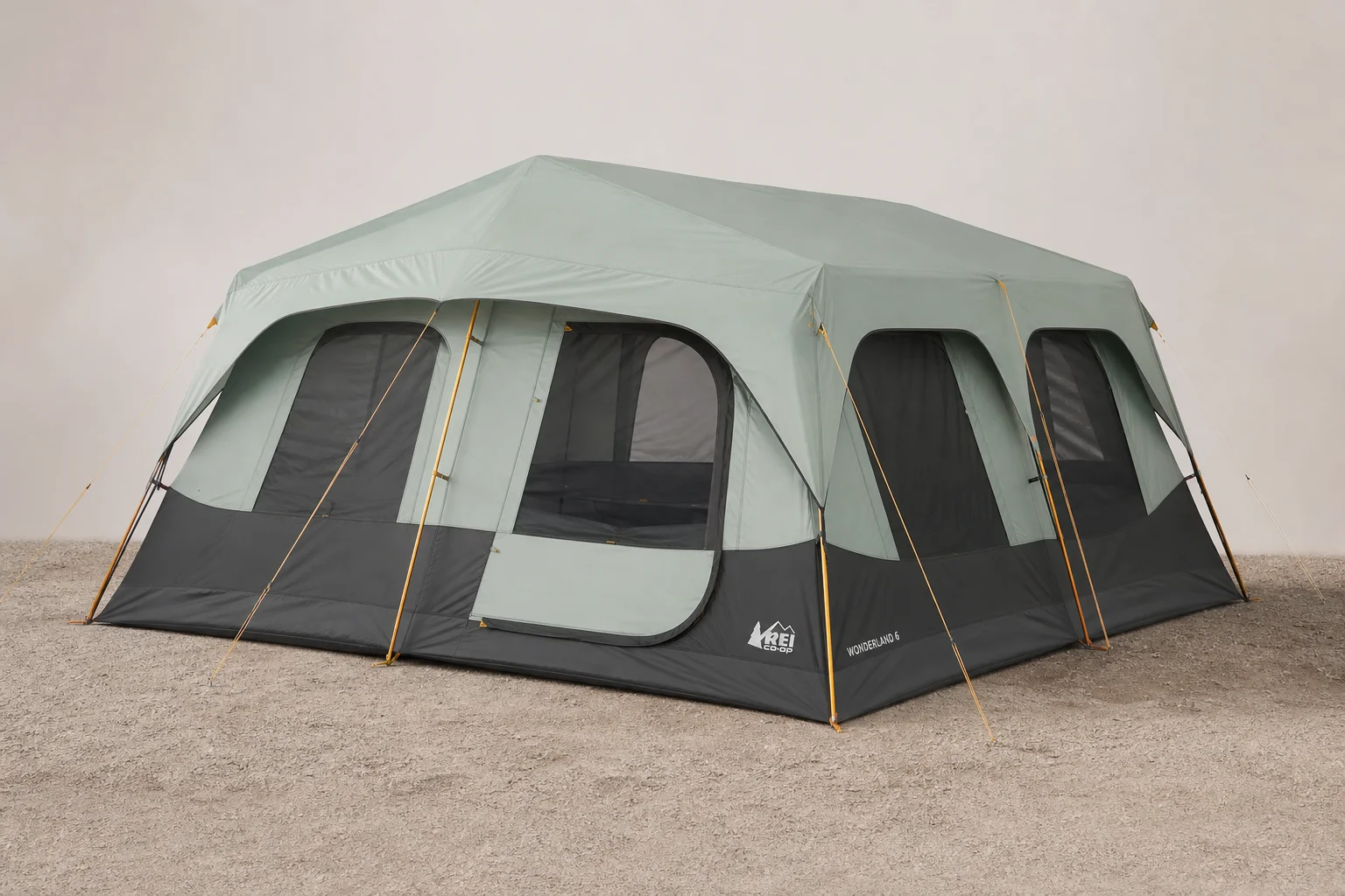 Six camping tents of varying sizes and styles arranged on a grey surface