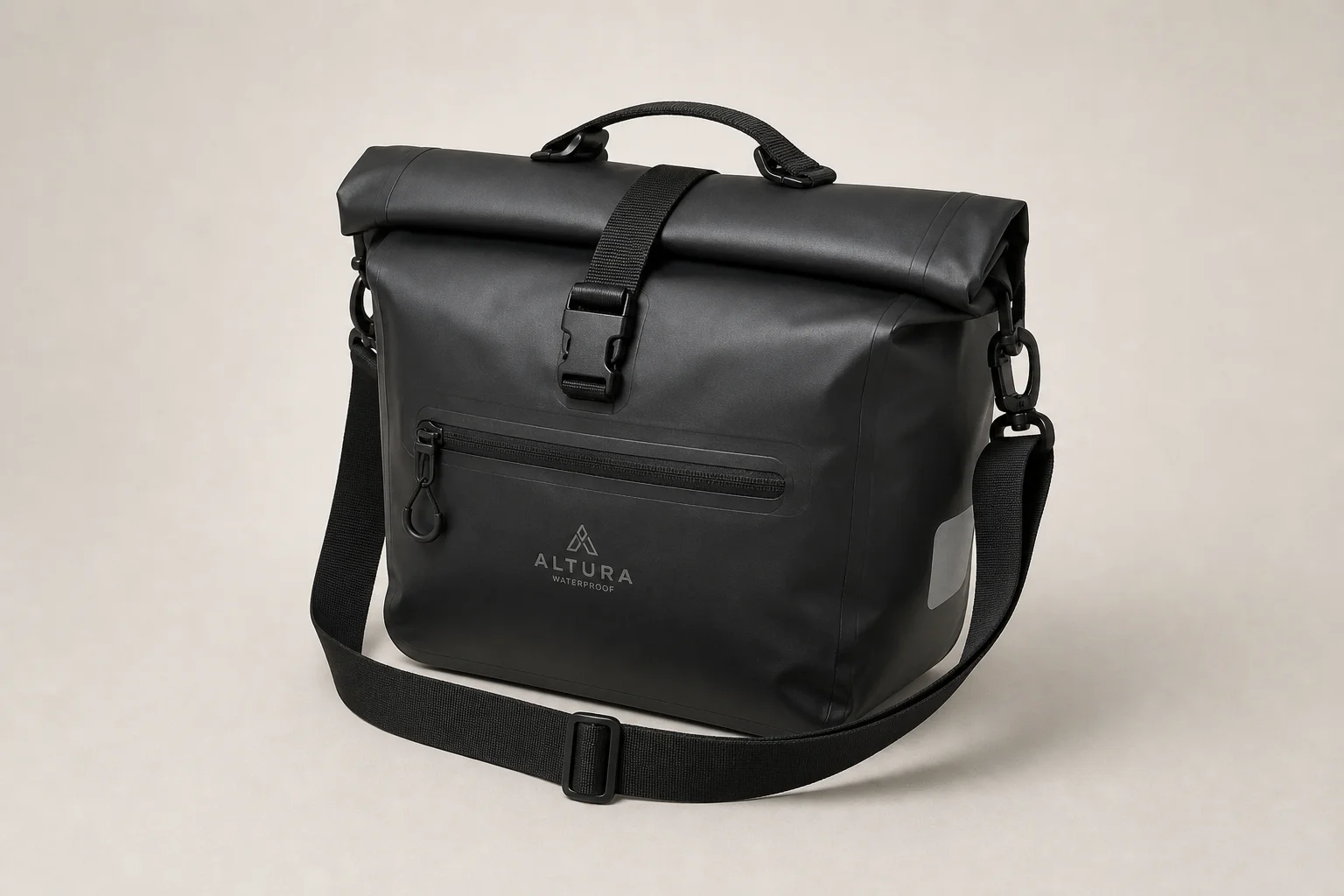 Five bike pannier bags in different styles and sizes arranged on concrete