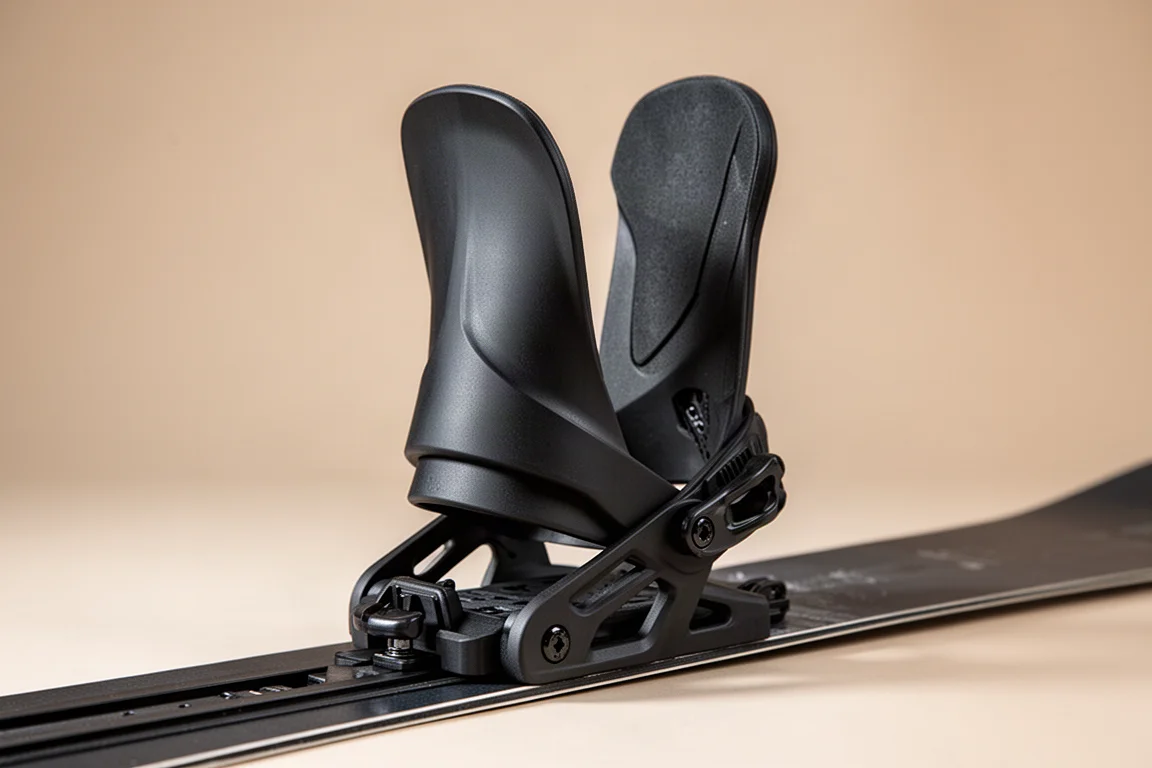 Close-up of a snowboard binding highback with forward lean adjustment