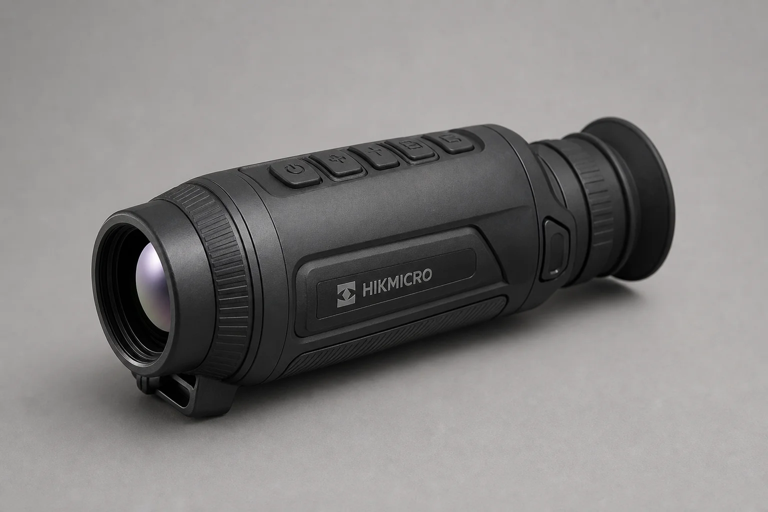 Five thermal imaging scopes displayed on concrete surface