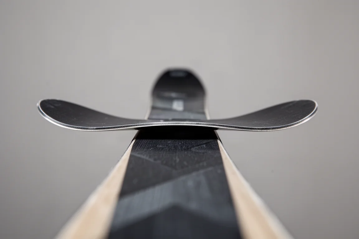 Close-up of a ski tip with visible camber and tip rocker profile
