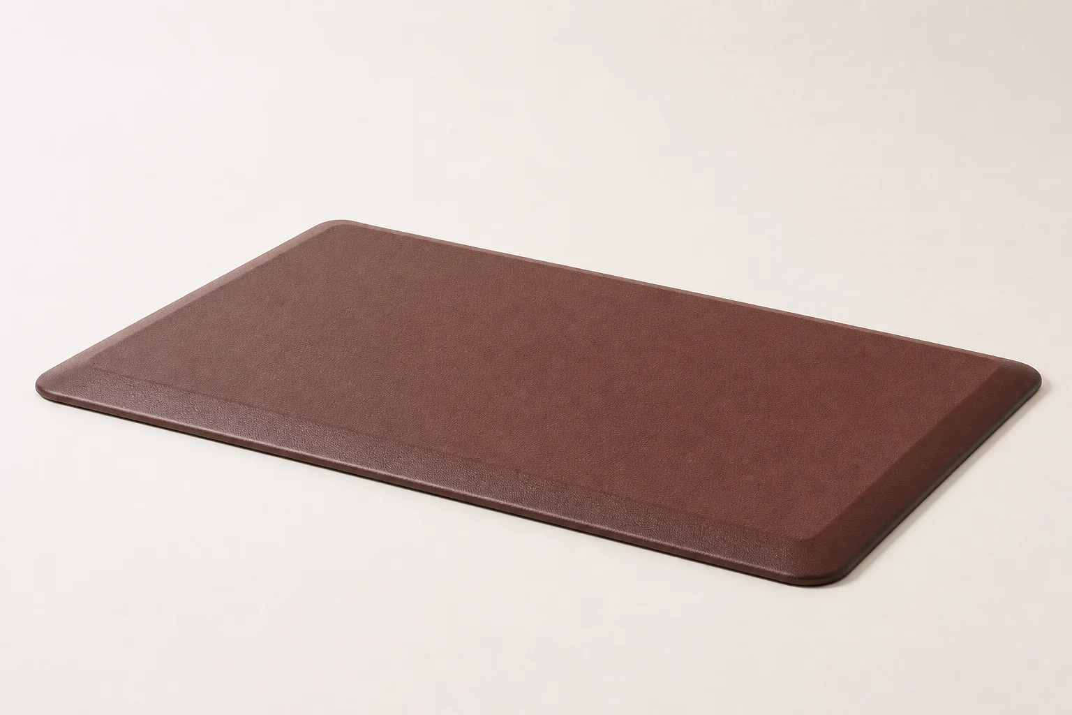 Five standing desk mats displayed on grey concrete surface