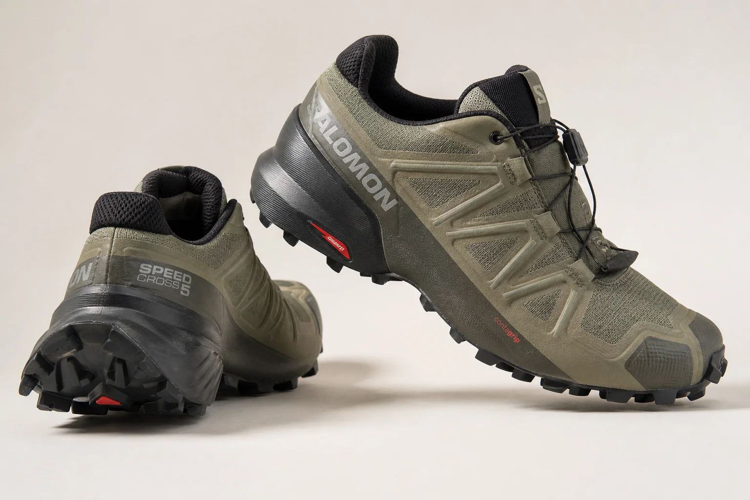 Salomon Speedcross 5 hiking shoes on neutral backdrop showing tread and mesh upper