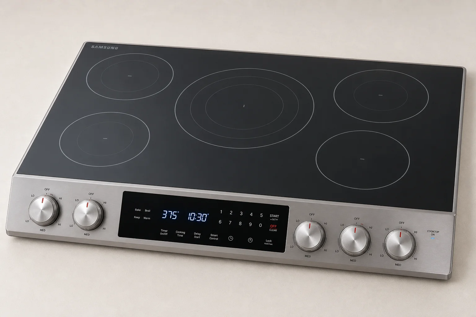 Five electric cooktops displayed in a line showing different designs and finishes