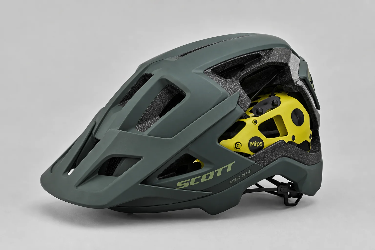 Five bike helmets of varying styles and price points arranged on concrete