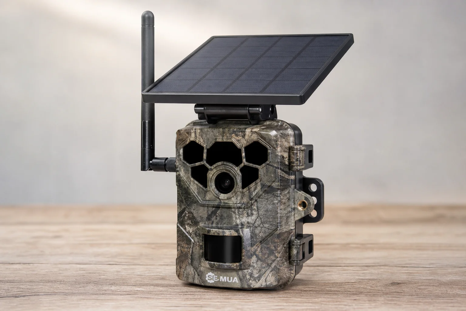 Five trail cameras in various designs arranged on concrete surface
