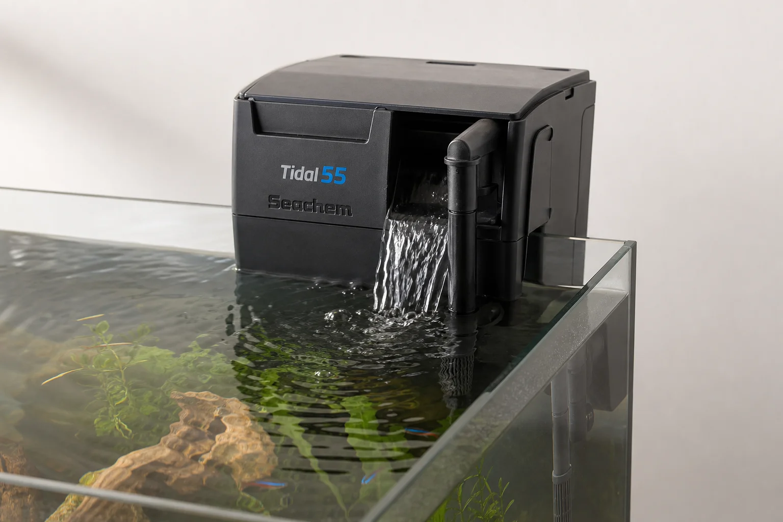 Four aquarium filter types displayed together on neutral surface