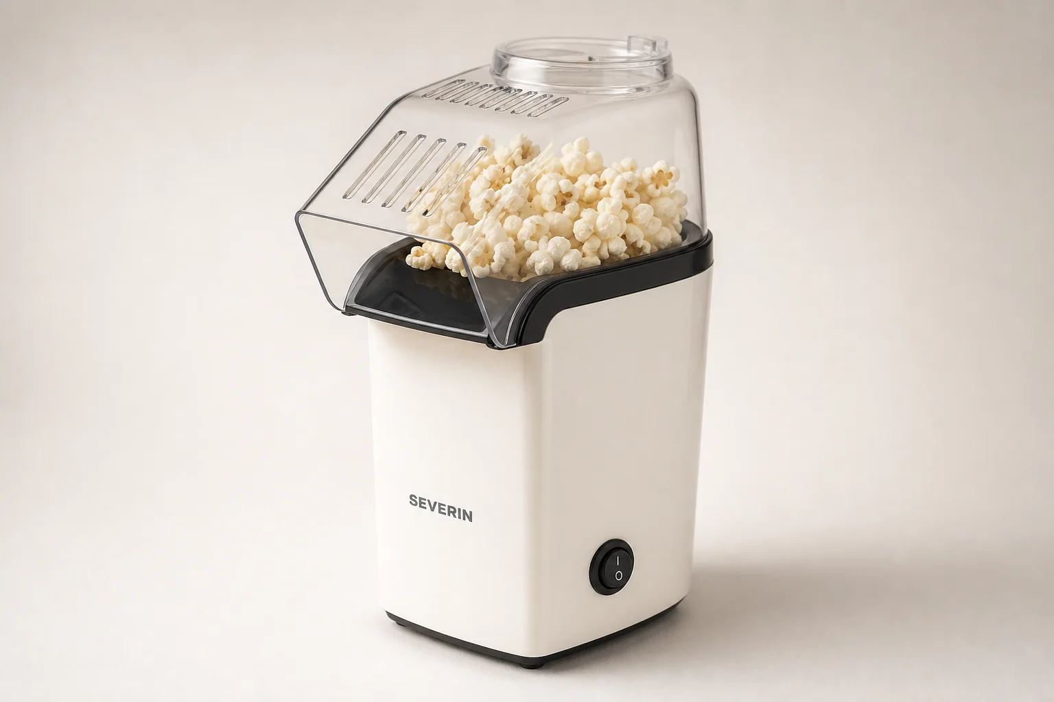 Home coffee roasting equipment including popcorn popper, green and roasted beans, colander, and scale