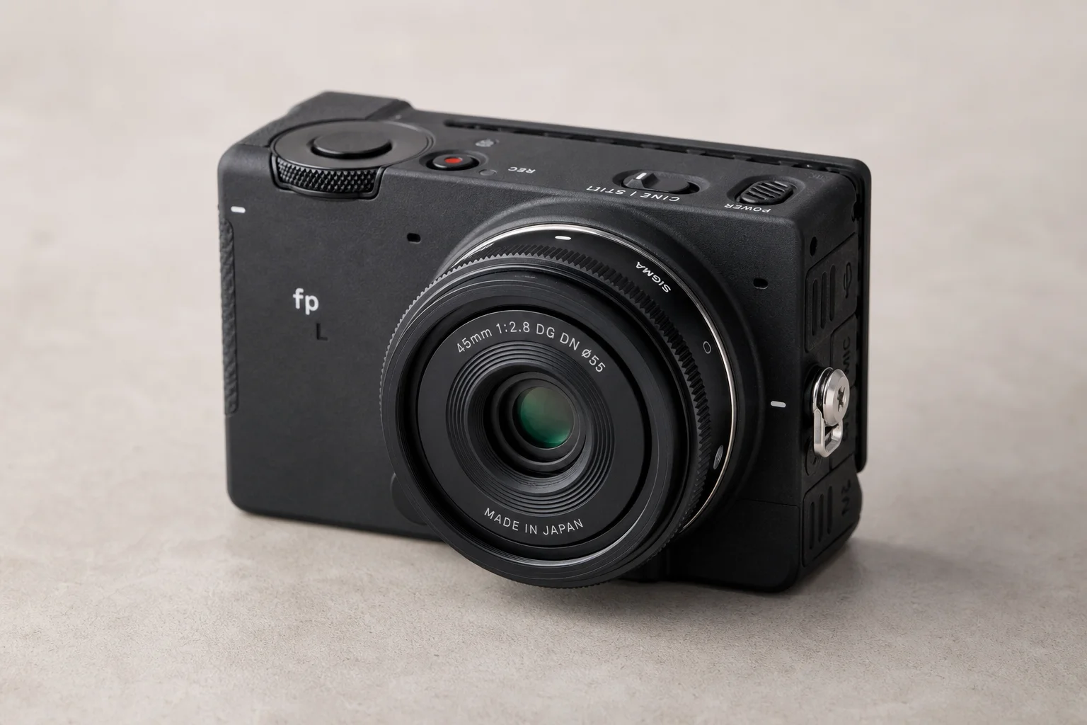 Compact lens mounted on Sigma fp L camera body
