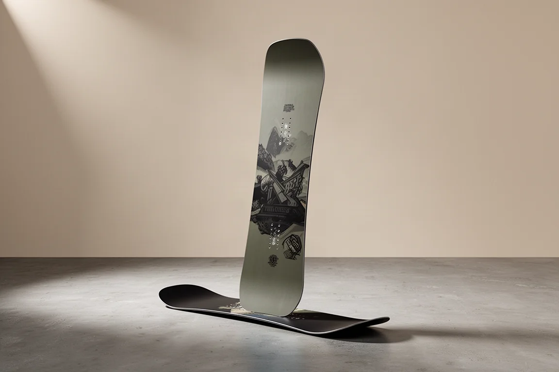 Volume-shifted freestyle snowboard standing upright on a matte concrete floor