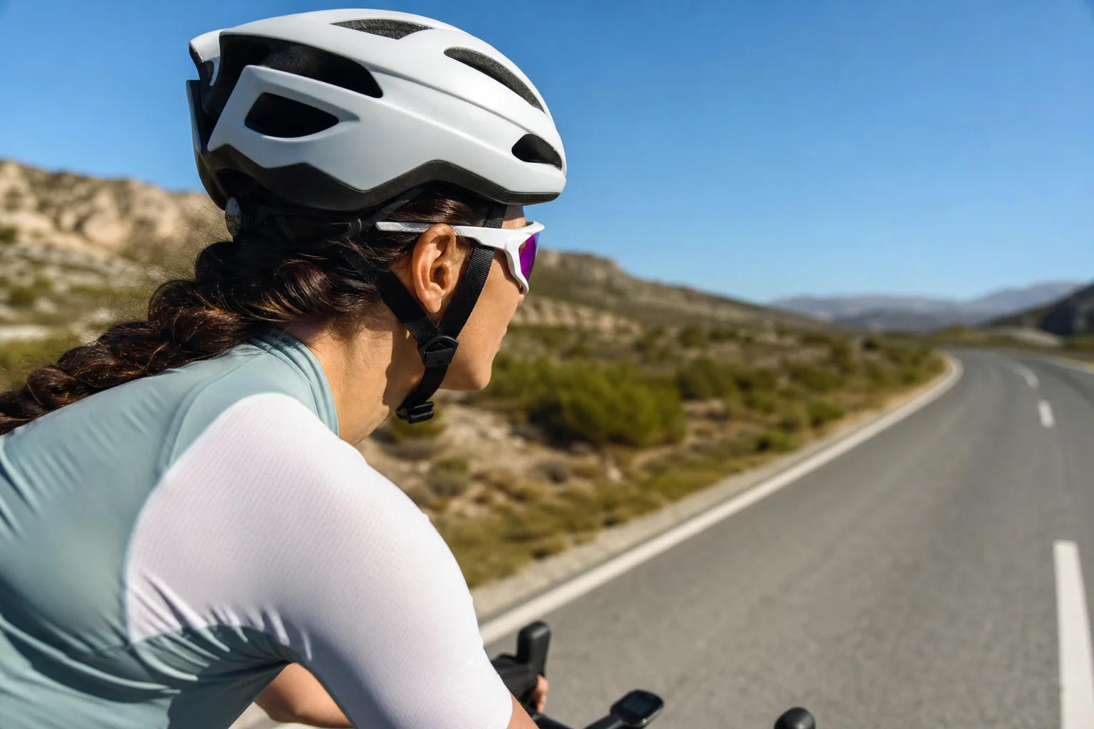 Cyclist wearing Smith Vert PivLock sunglasses on a sunny road ride