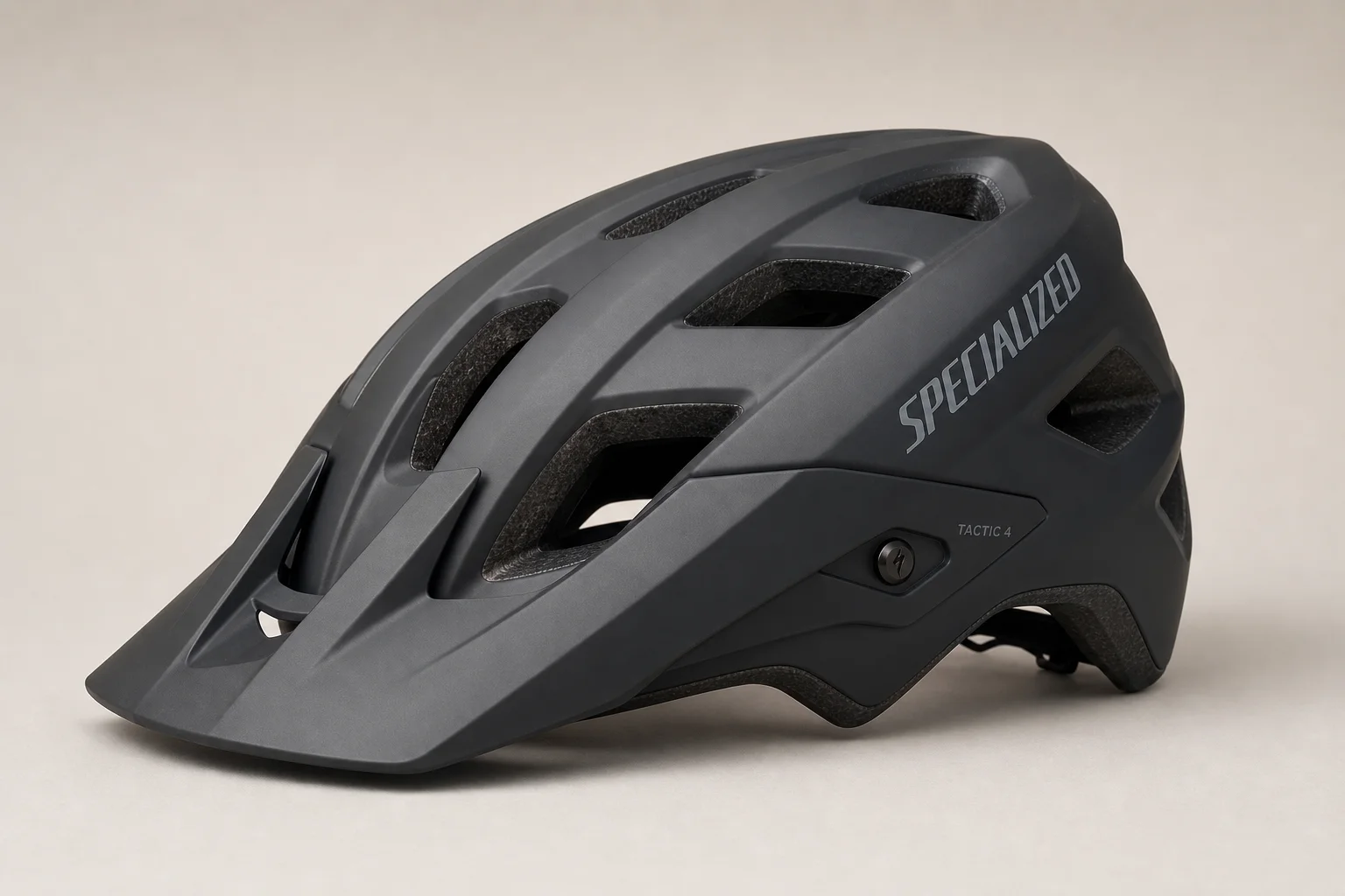 Five bike helmets of varying styles and price points arranged on concrete