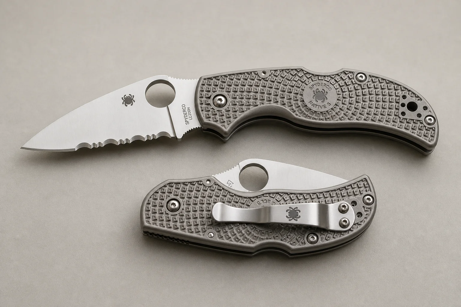 Collection of dive knives and cutting tools on concrete surface