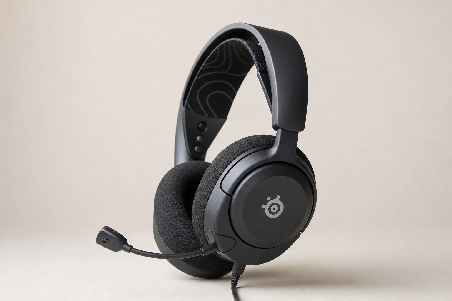 Six budget gaming headsets arranged on concrete surface