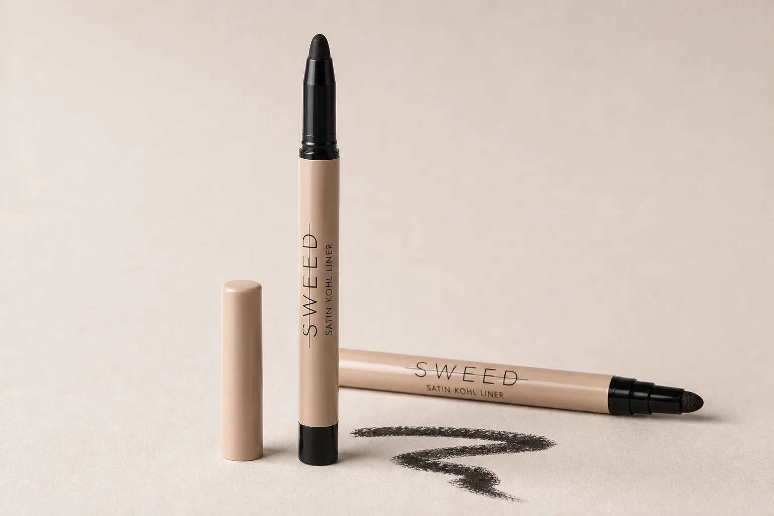 Sweed Beauty makeup collection arranged on concrete surface showing foundation, powder, blush, lipstick, and mascara