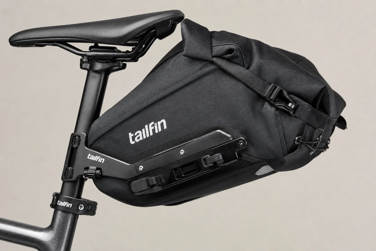 Complete Tailfin cargo system with AeroPack, panniers, and top tube bag on concrete