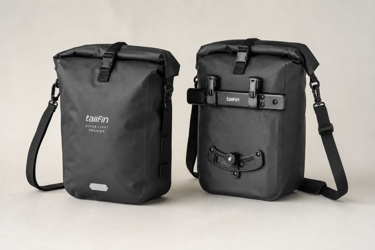 Complete Tailfin cargo system with AeroPack, panniers, and top tube bag on concrete