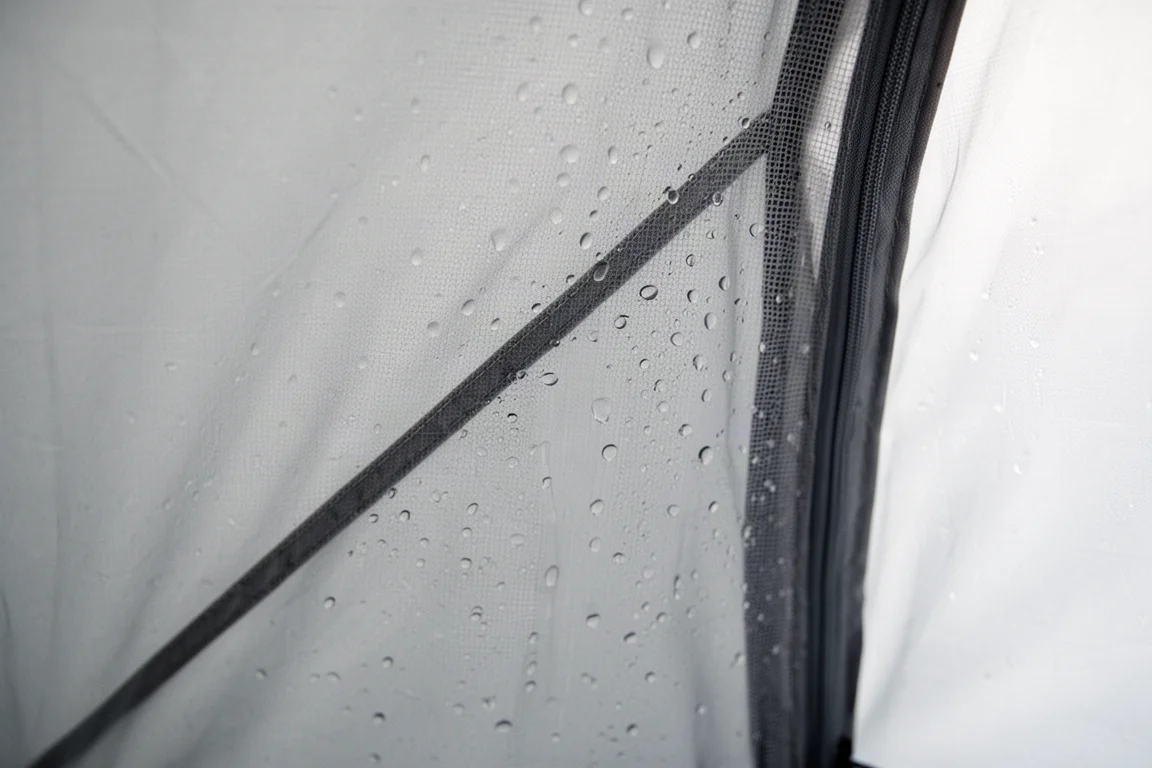 Condensation droplets on the mesh inner wall of a small tent