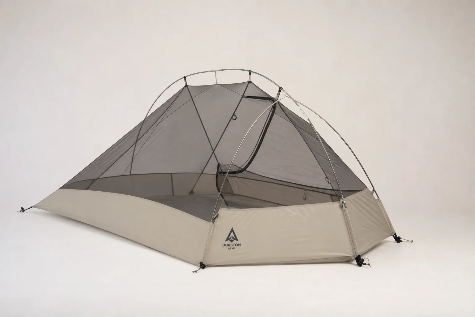 Seven survival tents of varying sizes and styles arranged on neutral backdrop