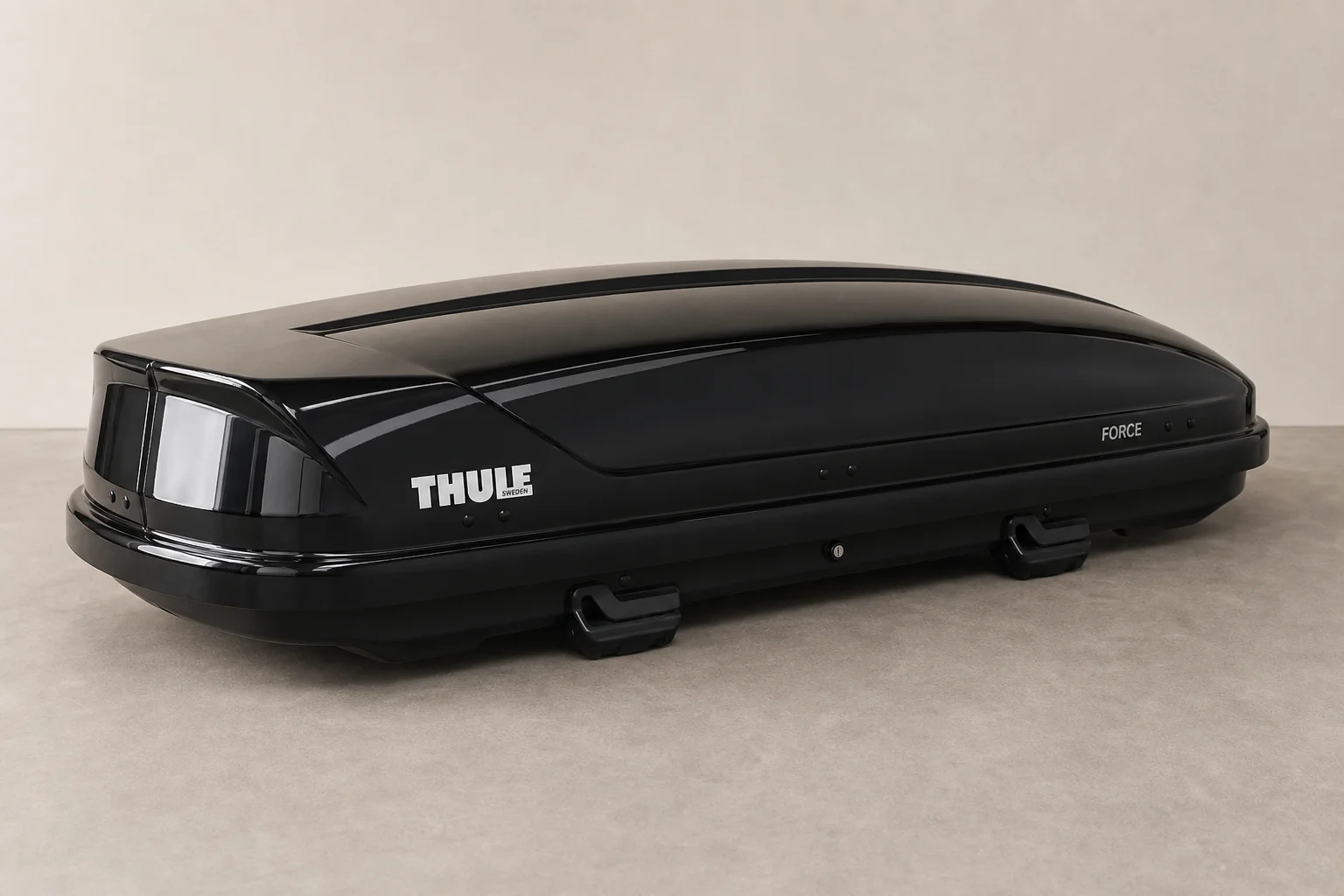 Rooftop cargo box mounted on vehicle roof rack with aerodynamic design