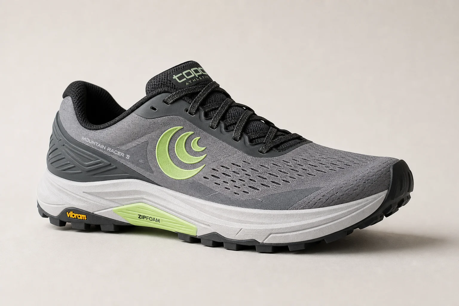Three trail running shoes arranged on concrete: Topo Mountain Racer 3, HOKA Speedgoat 6, and Salomon XA Pro 3D
