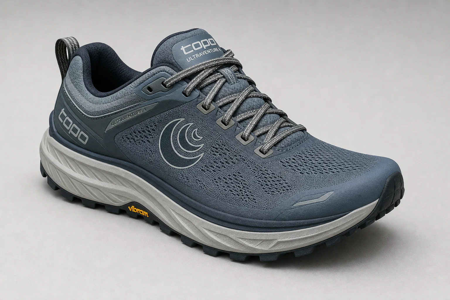 Five trail running shoes arranged on concrete surface representing different styles and purposes
