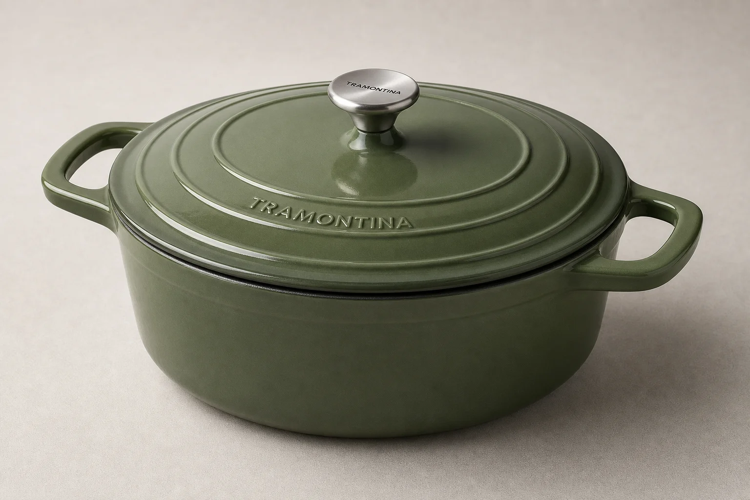 Collection of nine Dutch ovens in various colors and finishes arranged on neutral backdrop