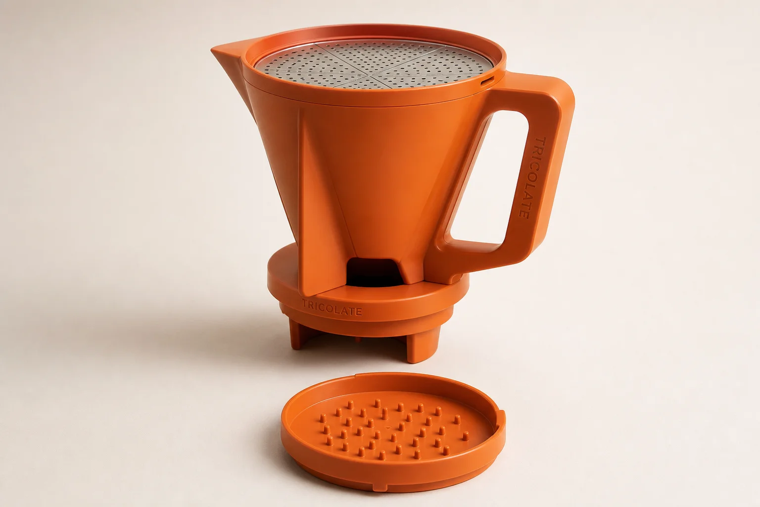 Tricolate and Next Level pour-over brewers side by side on concrete