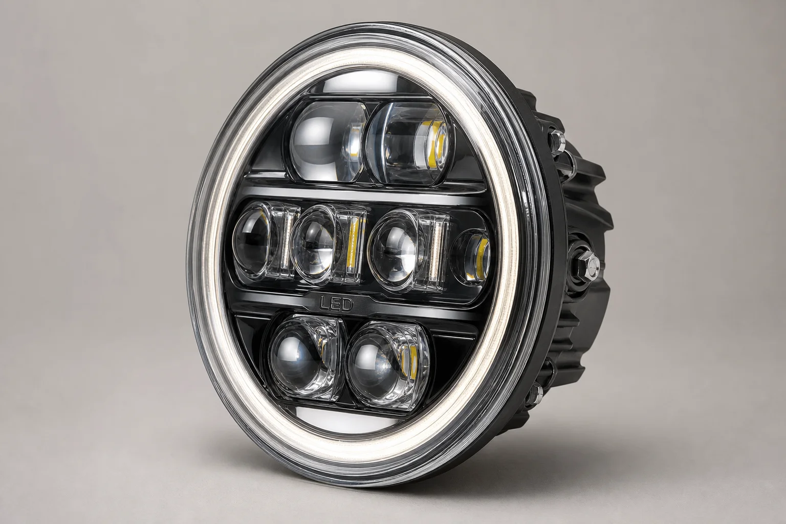 Five LED and drop-in headlights arranged on concrete surface