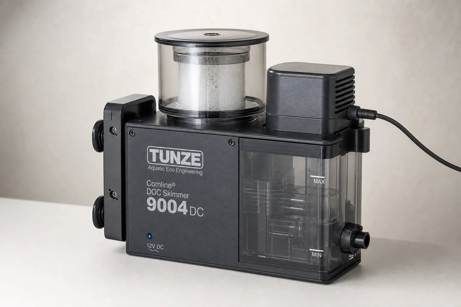 Three protein skimmers: Reef Octopus Classic 100, Classic 1000, and Tunze 9004 DC on neutral surface