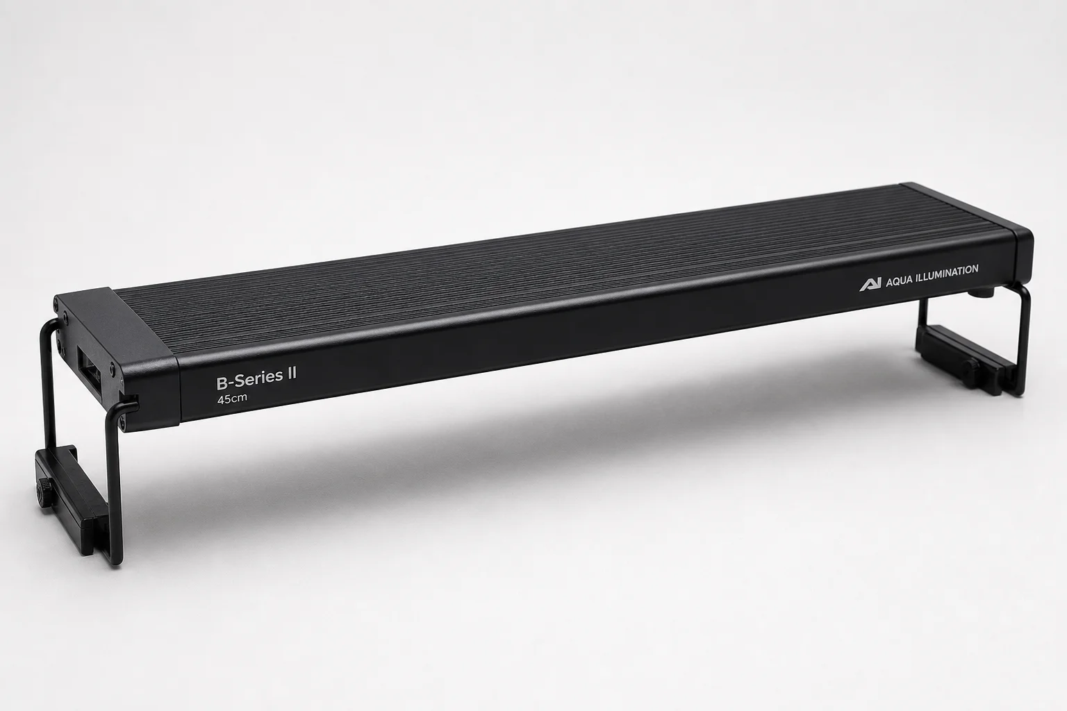 TwinStar A-Series II and B-Series II aquarium lights with controllers on grey surface